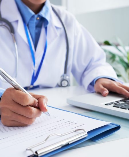 hands-unrecognizable-female-doctor-writing-form-typing-laptop-keyboard (1) hands-unrecognizable-female-doctor-writing-form-typing-laptop-keyboard (1)